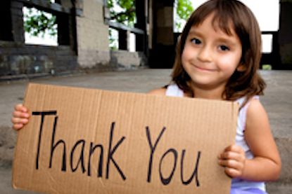 girl with thank you sign - The Concept of Gratitude